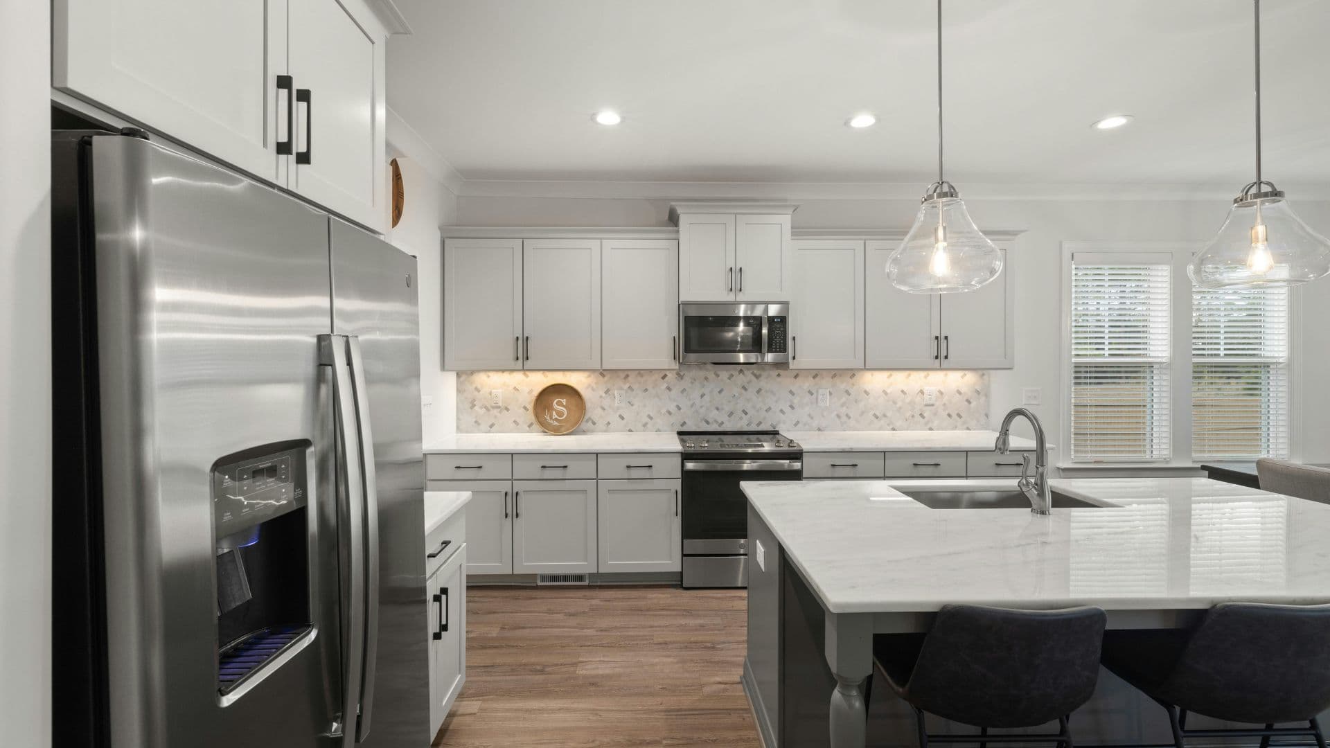 Classic kitchen renovation with refreshed cabinets.